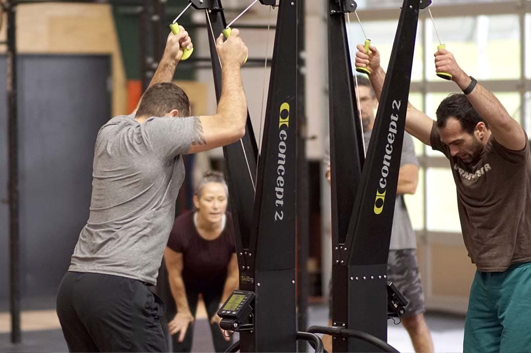 People on SkiErg competing