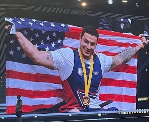Athlete Jason Smith celebrating a medal win